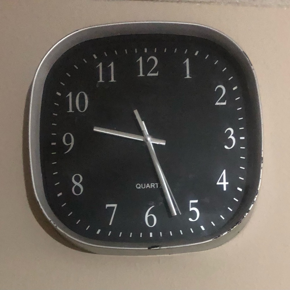 Sleek Black and Silver Wall Clock